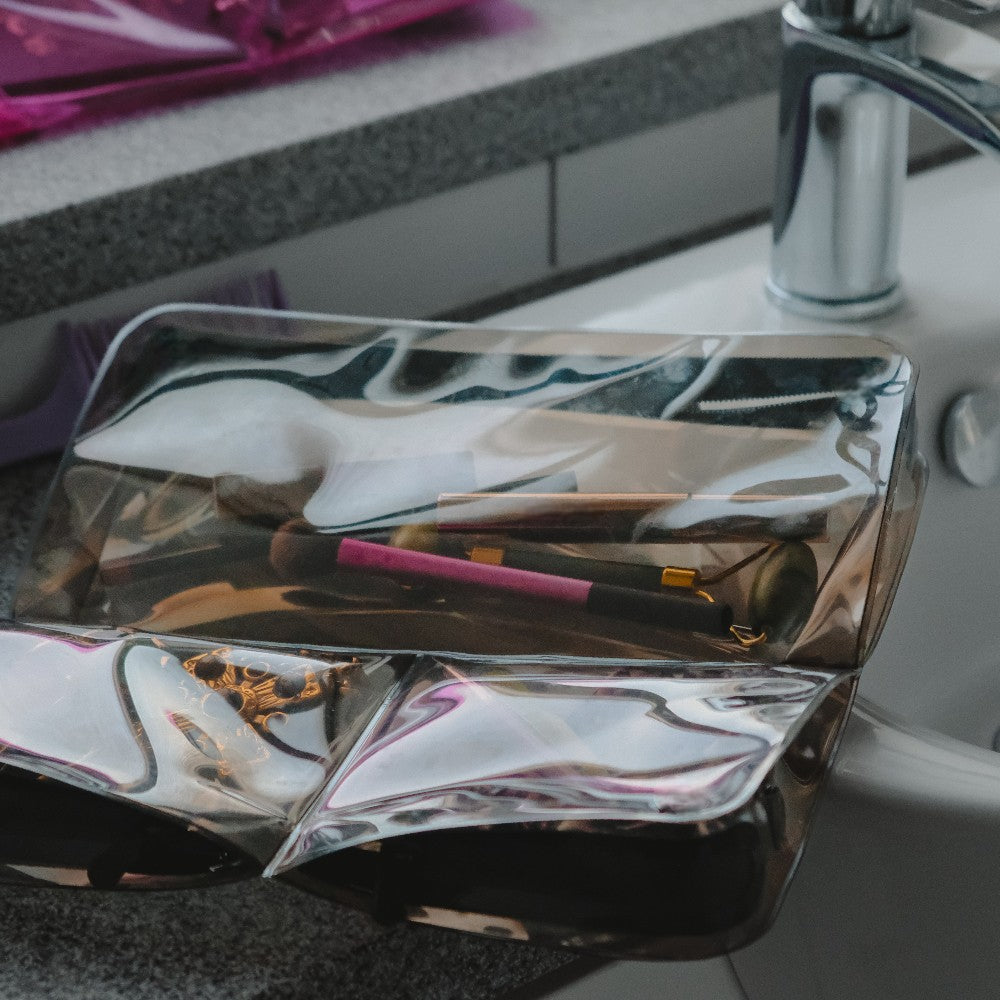 DivideNPac mink gray organizer storing beauty tools, skincare products, and jewelry in separated compartments