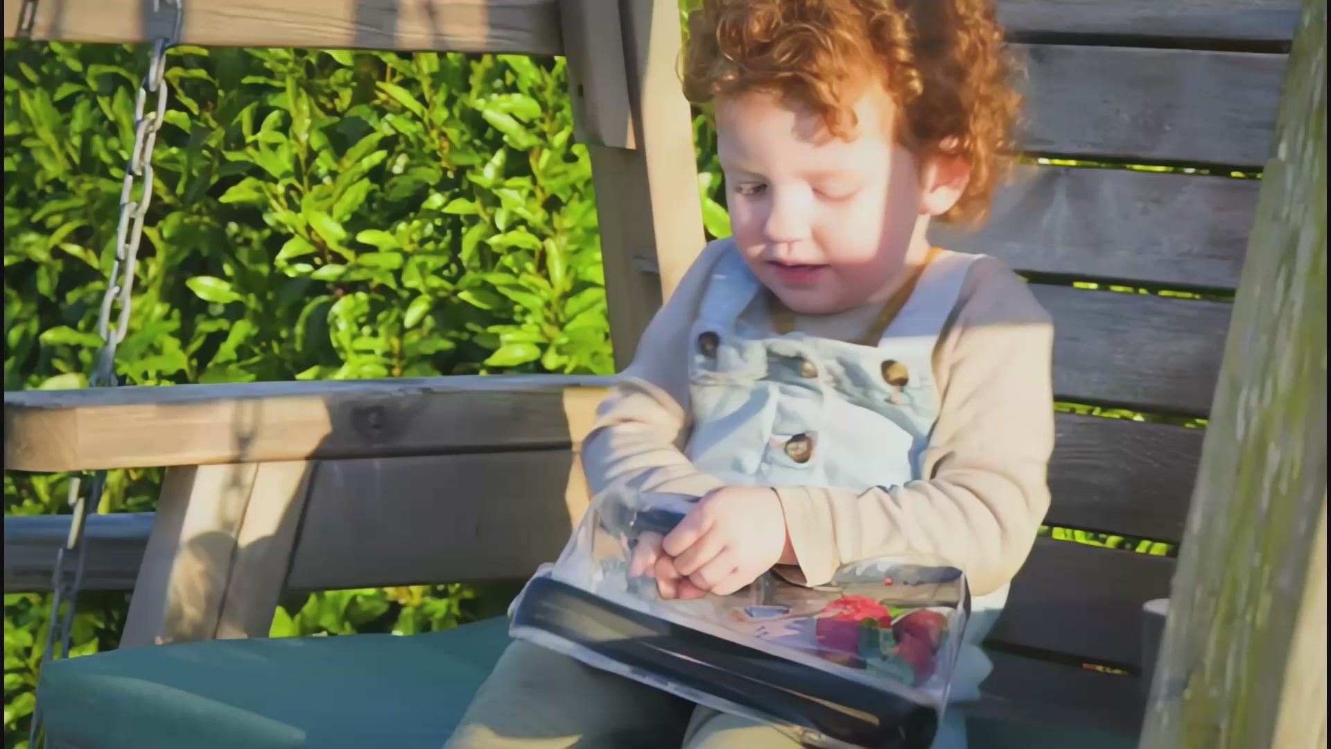 Toddler outdoors eating separated snacks from a DivideNPac food-grade 3-compartment organizer. Allergy-friendly, mess-free.
