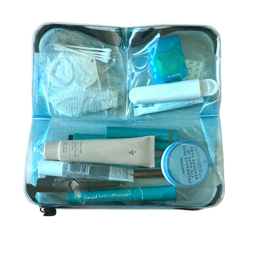 DivideNPac blue TSA-approved organizer with toiletries and skincare products separated in three open compartments